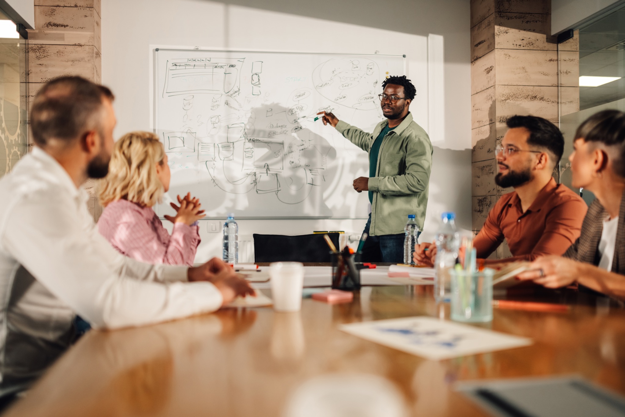 Colleagues listening during a business strategy discussion.